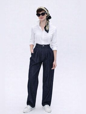 Emporio Armani dark navy jeans with fine lurex treads.